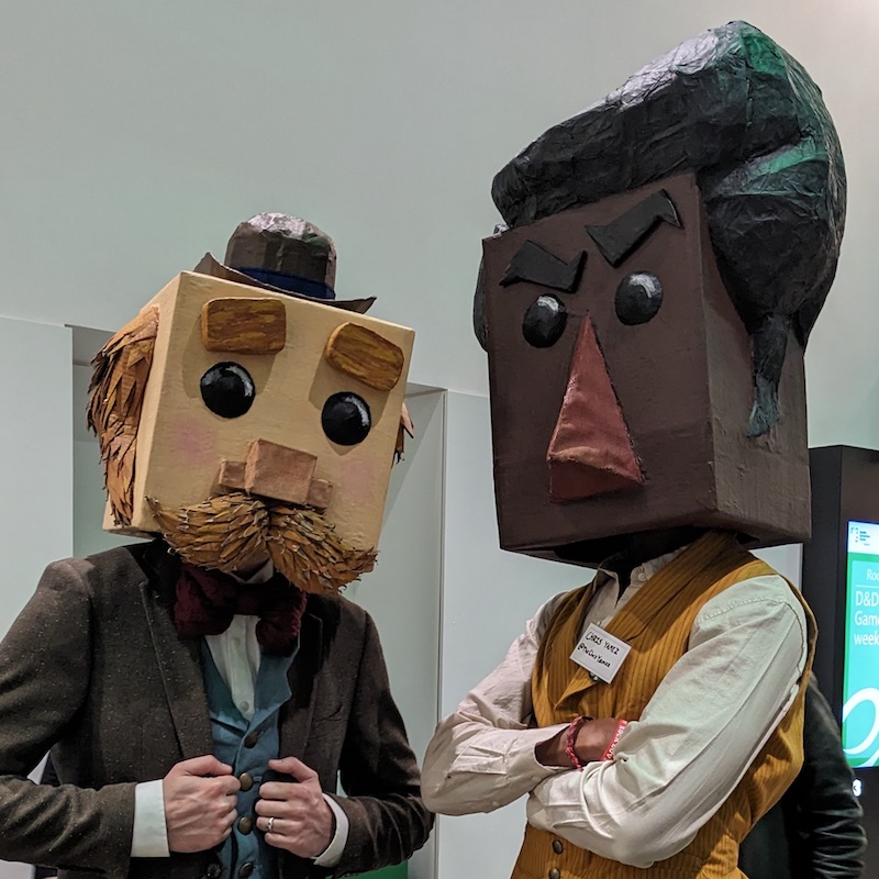 Two people, both wearing Victorian era men's clothing and large box-shaped character heads with simple faces and no mouths. Link takes you to project page.